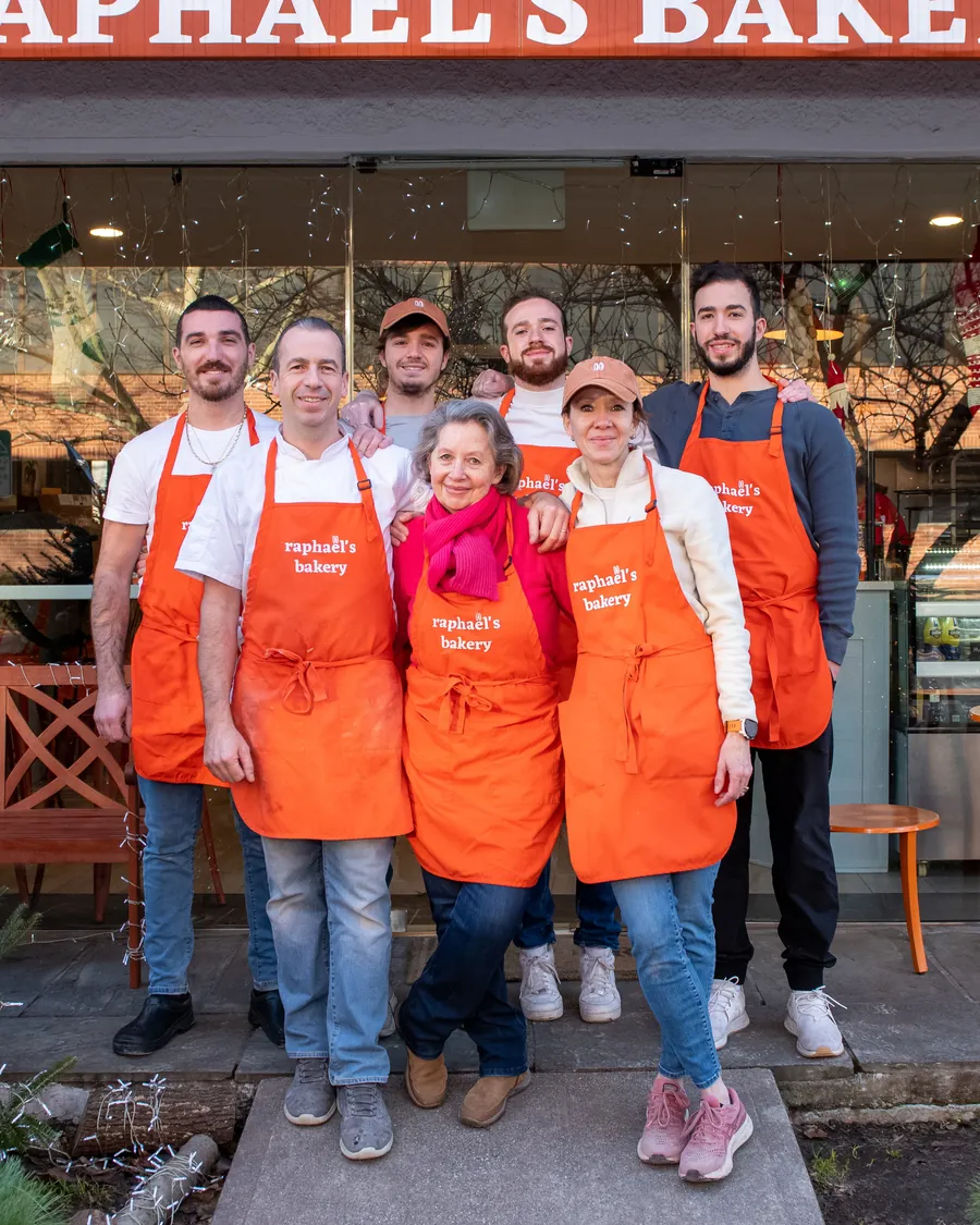 The Dequeker family in their orange Raphaël's Bakery aprons